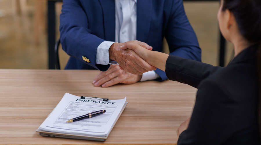 Insurance Agent Shaking Clients Hand